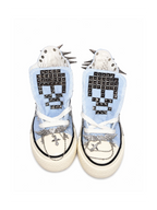 Baby blue studded high-top sneakers front top view with skull tongue studs and chain accents