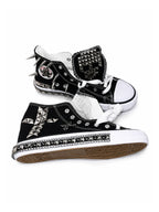 Black flat studded high-top sneakers side view with chain trim and cross hardware