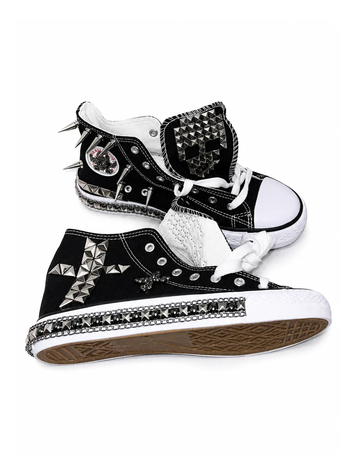 Black flat studded high-top sneakers side view with chain trim and cross hardware