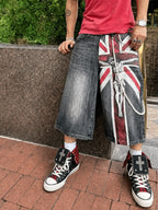 Red check cross studded high-top sneakers styled with wide shorts