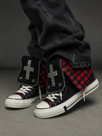 Red check cross studded high-top sneakers worn side view