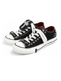 Red check cross buckle low-top sneakers on white background