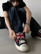 Black red distressed low-top sneakers lace-up detail