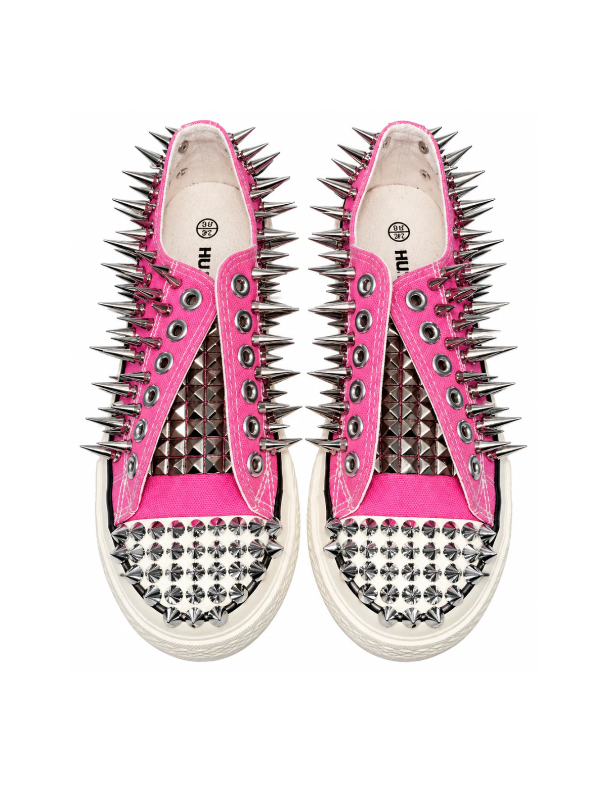Pink spiked low-top sneakers top front detail on white background