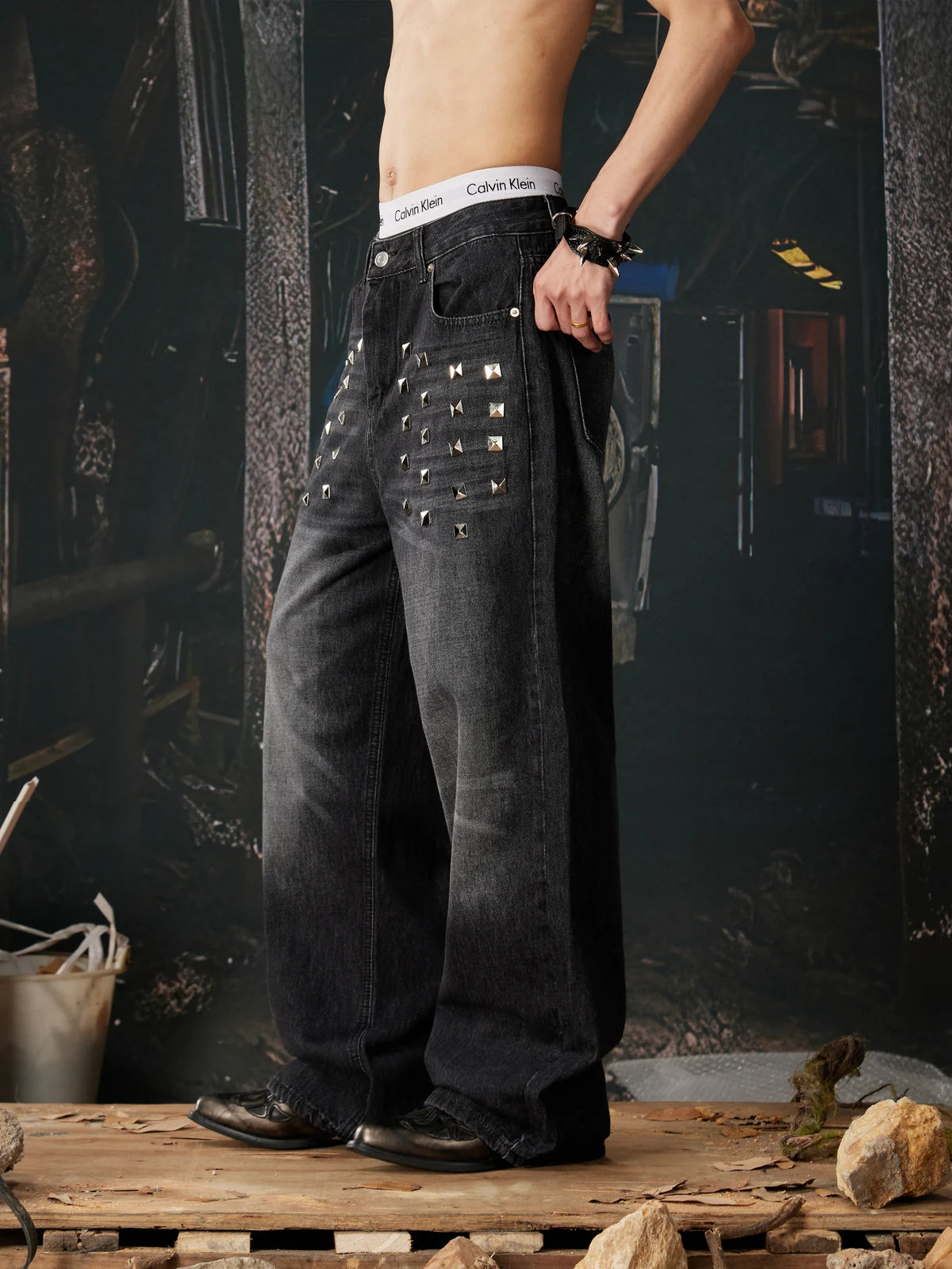 Black Riveted Fade Baggy Jeans three-quarter model view