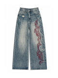 The "Tribal Flame" Embroidered Jeans in blue on a white background, front view