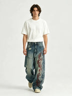 The "Tribal Flame" Embroidered Jeans in blue, studio front view