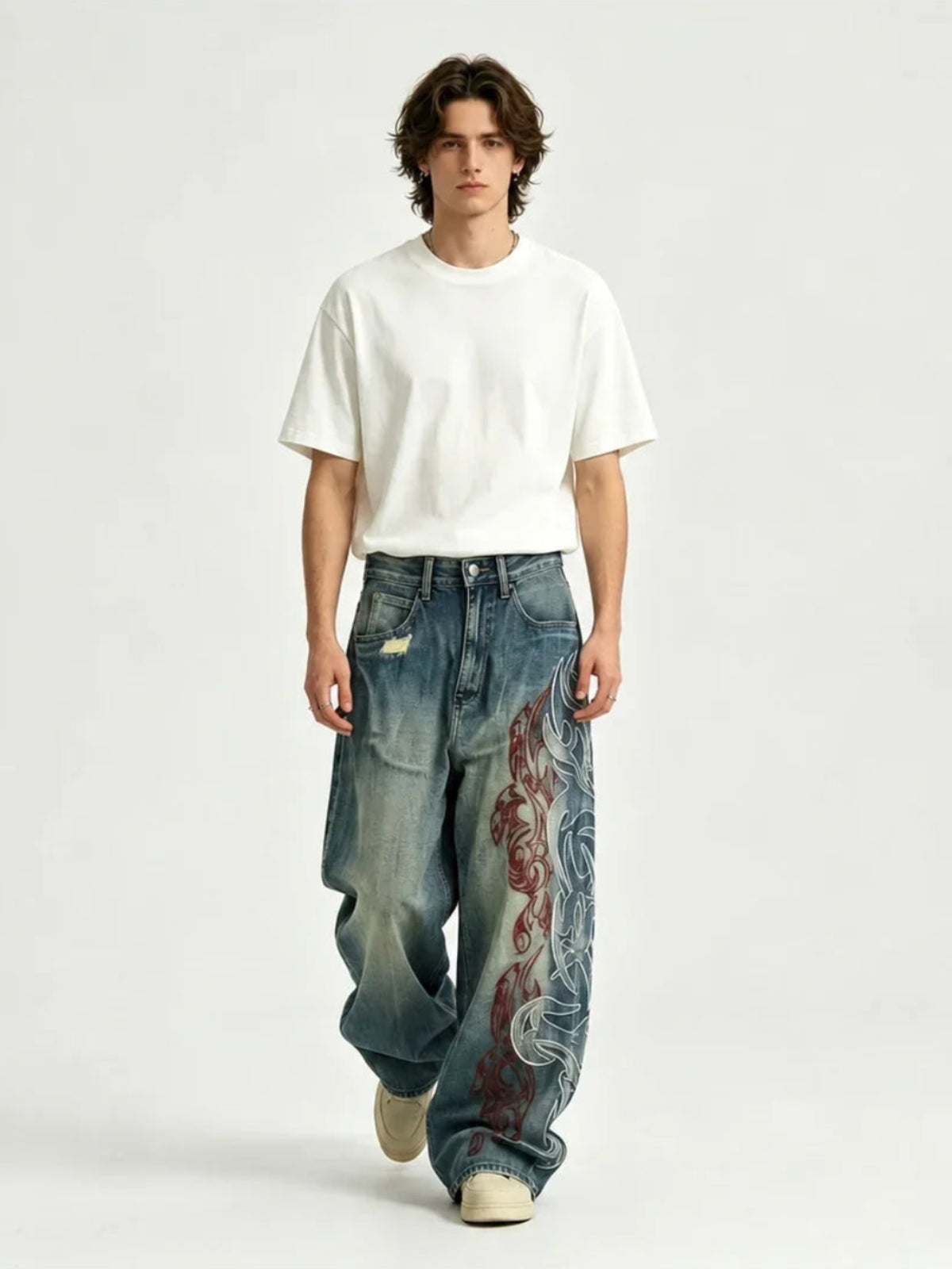 The "Tribal Flame" Embroidered Jeans in blue, studio front view