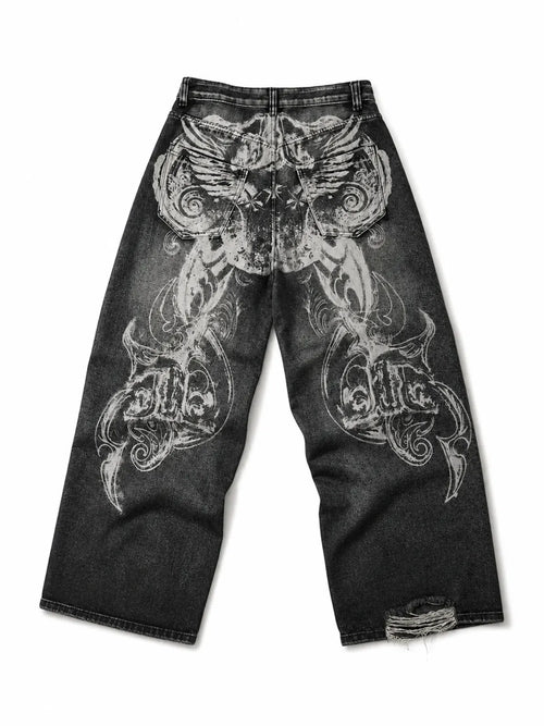The Skeletal Wings Distressed Jeans in washed black, natural flat lay on a pure white background, back graphic view