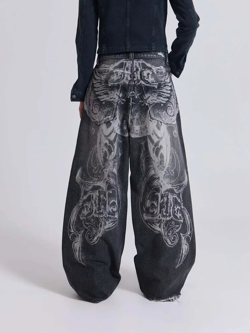 The Skeletal Wings Distressed Jeans styled on model, studio full-body back view