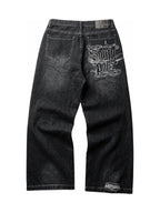 The Polar Script Washed Jeans in black on a pure white background, back graphic view
