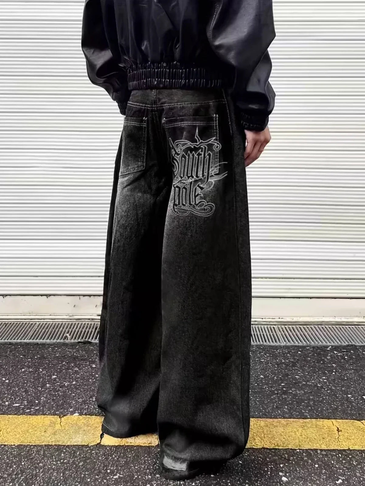 The Polar Script Washed Jeans in black, back-view industrial streetwear styling