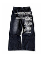 Black Whispered Words Printed Jeans on a pure white background, front view