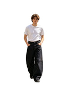 Gothic Cross black wide-leg jeans, front walking view, white background