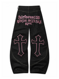 Gothic Cross black jeans with pink cross embroidery, natural flat-lay back view, white background