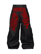 The Shibuya Dragon Graphic Jeans in black, back product view with red dragon graphics on white