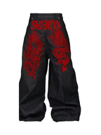 The Shibuya Dragon Graphic Jeans in black, back view with red dragon graphics