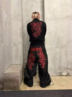 The Shibuya Dragon Graphic Jeans styled from the back against concrete