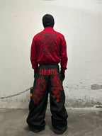 The Shibuya Dragon Graphic Jeans styled from the back with a red jacket