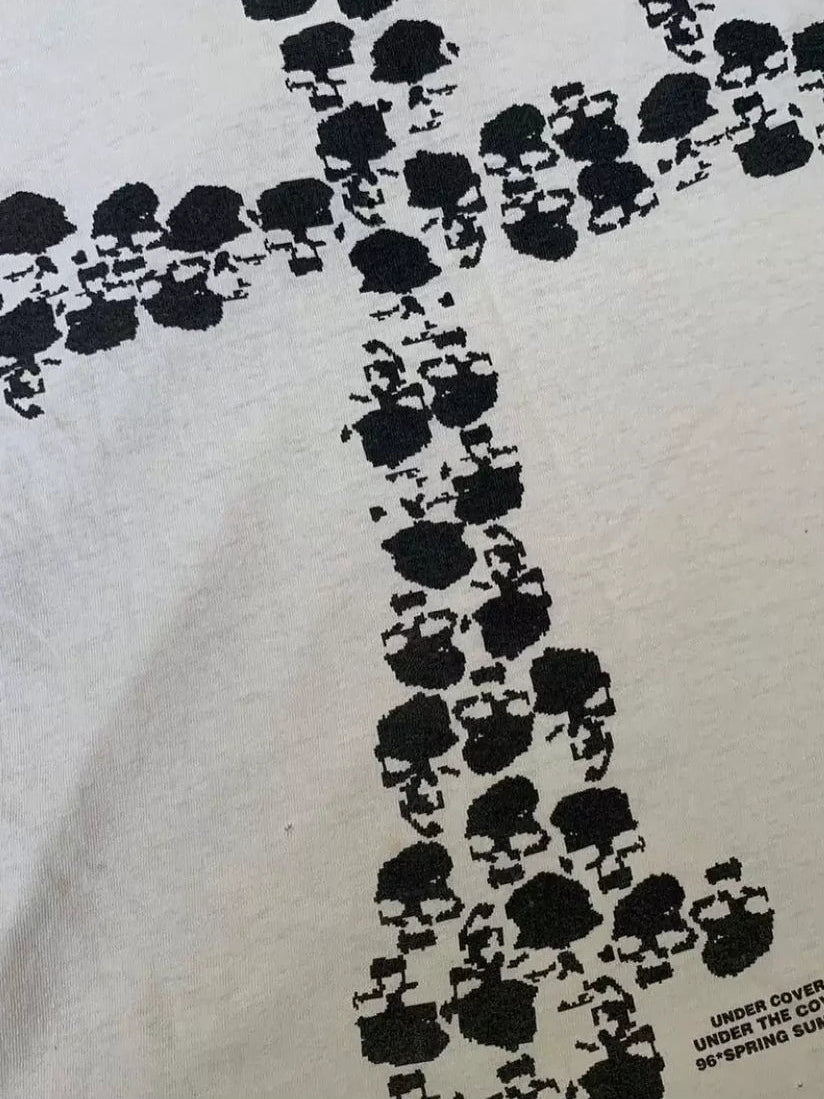 Close-up of the black skull cross print on white cotton jersey