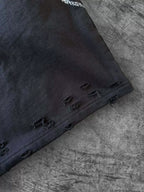 Black laced straight-leg pants distressed hem detail