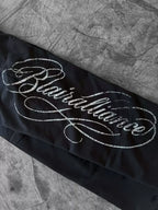 Black laced straight-leg pants side script graphic detail
