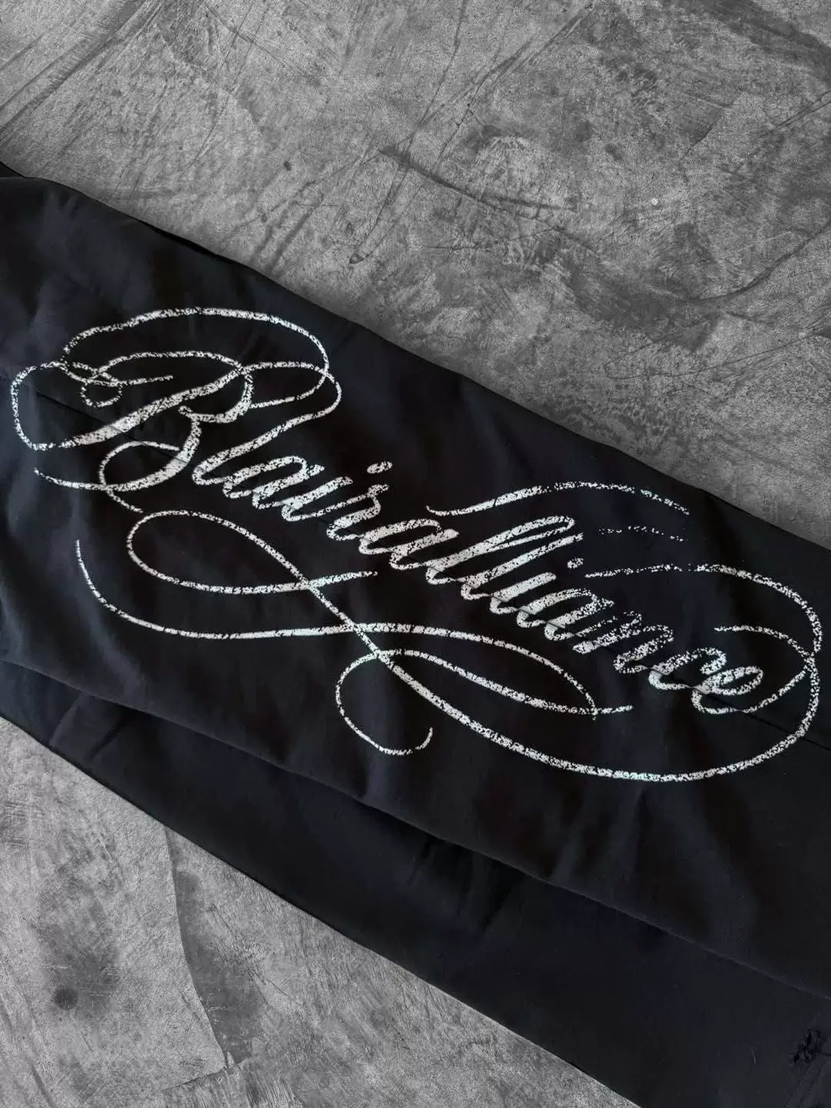 Black laced straight-leg pants side script graphic detail