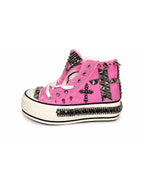 Pink studded high-top shoes platform sole side view