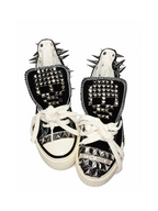 Black studded high-top sneakers front view