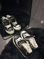 Black studded high-top sneakers lifestyle view