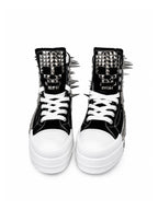 Black and white studded platform high-top sneakers, front view