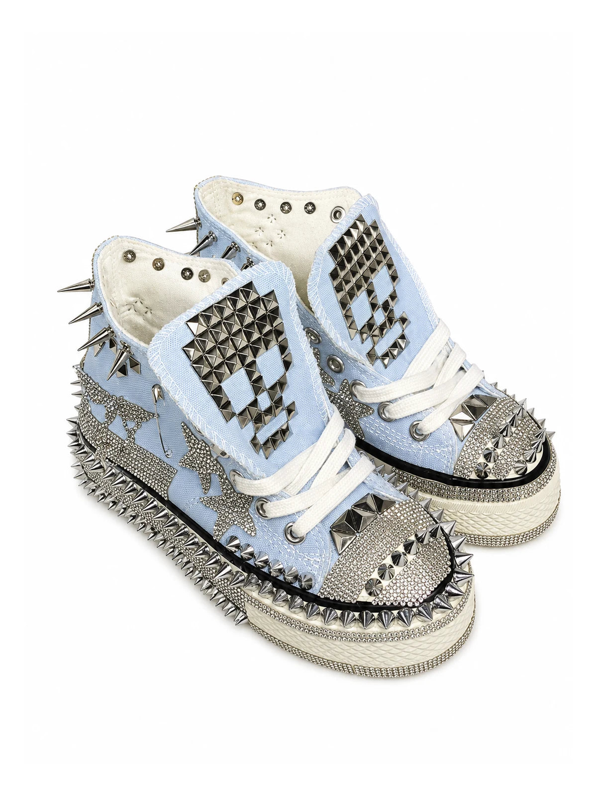 Baby-blue studded high-top sneakers with crystal stars and skull tongue, front angle