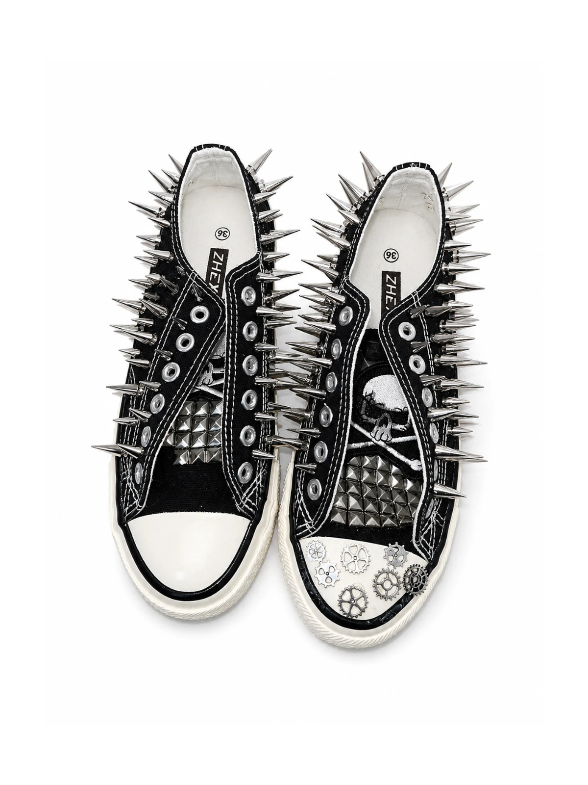 Black spiked low-top sneakers with skull patches and gear accents, top view