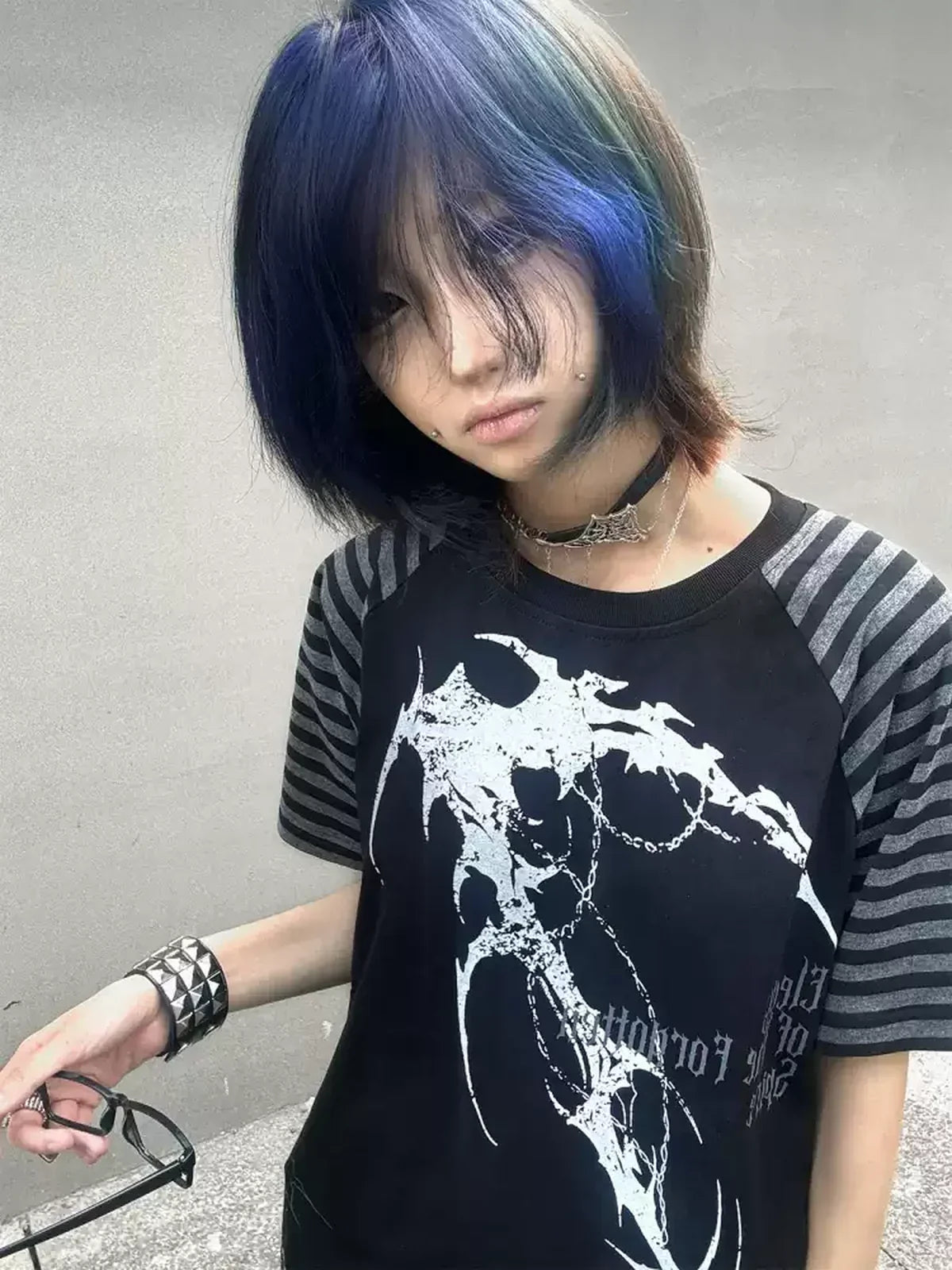 Close-up of the black Midnight Verse Raglan Graphic Tee with blue-hair styling