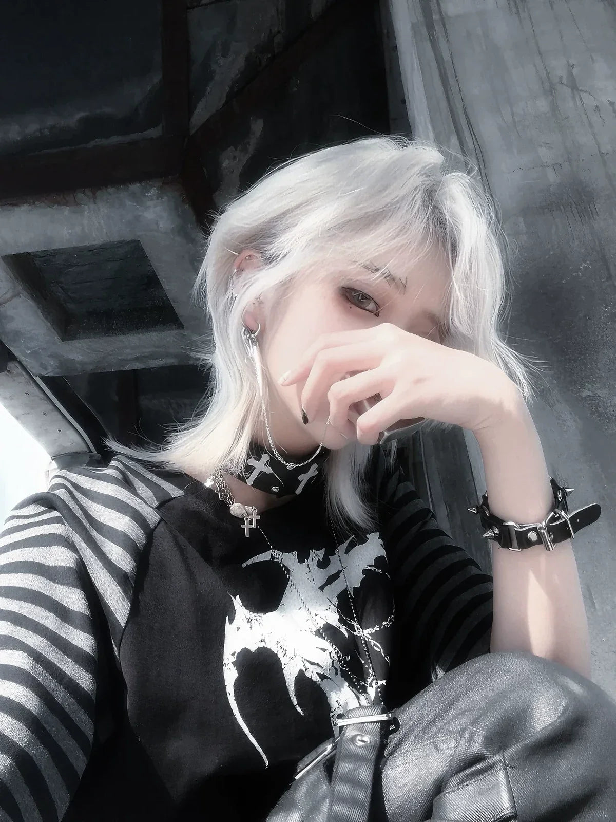 Black Midnight Verse Raglan Graphic Tee in a seated close-up streetwear look