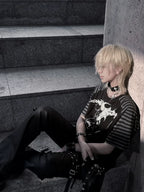 Black Midnight Verse Raglan Graphic Tee styled in a wide seated streetwear look