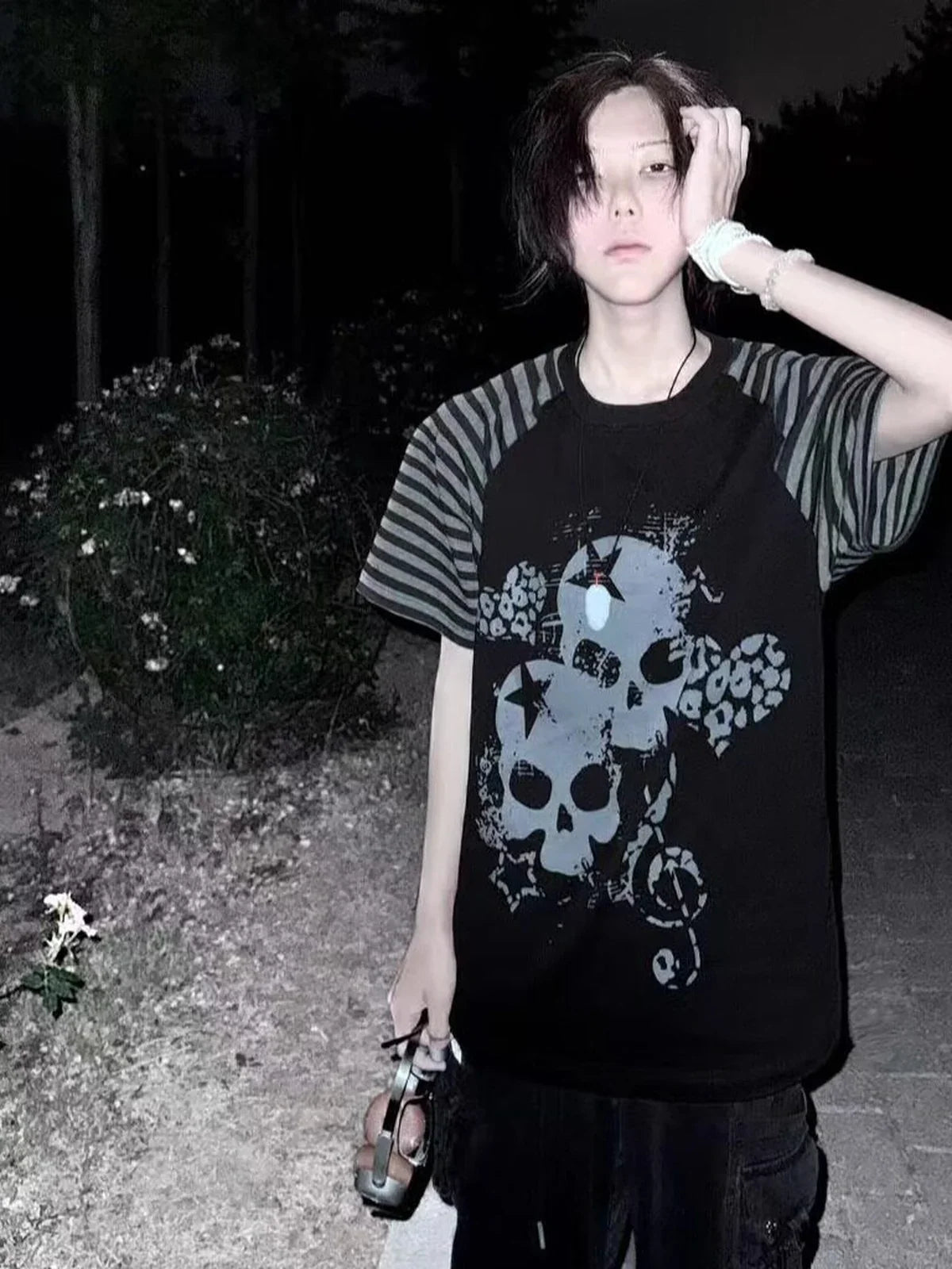 Black Skull Leopard Raglan Graphic Tee in a nighttime full-body streetwear look