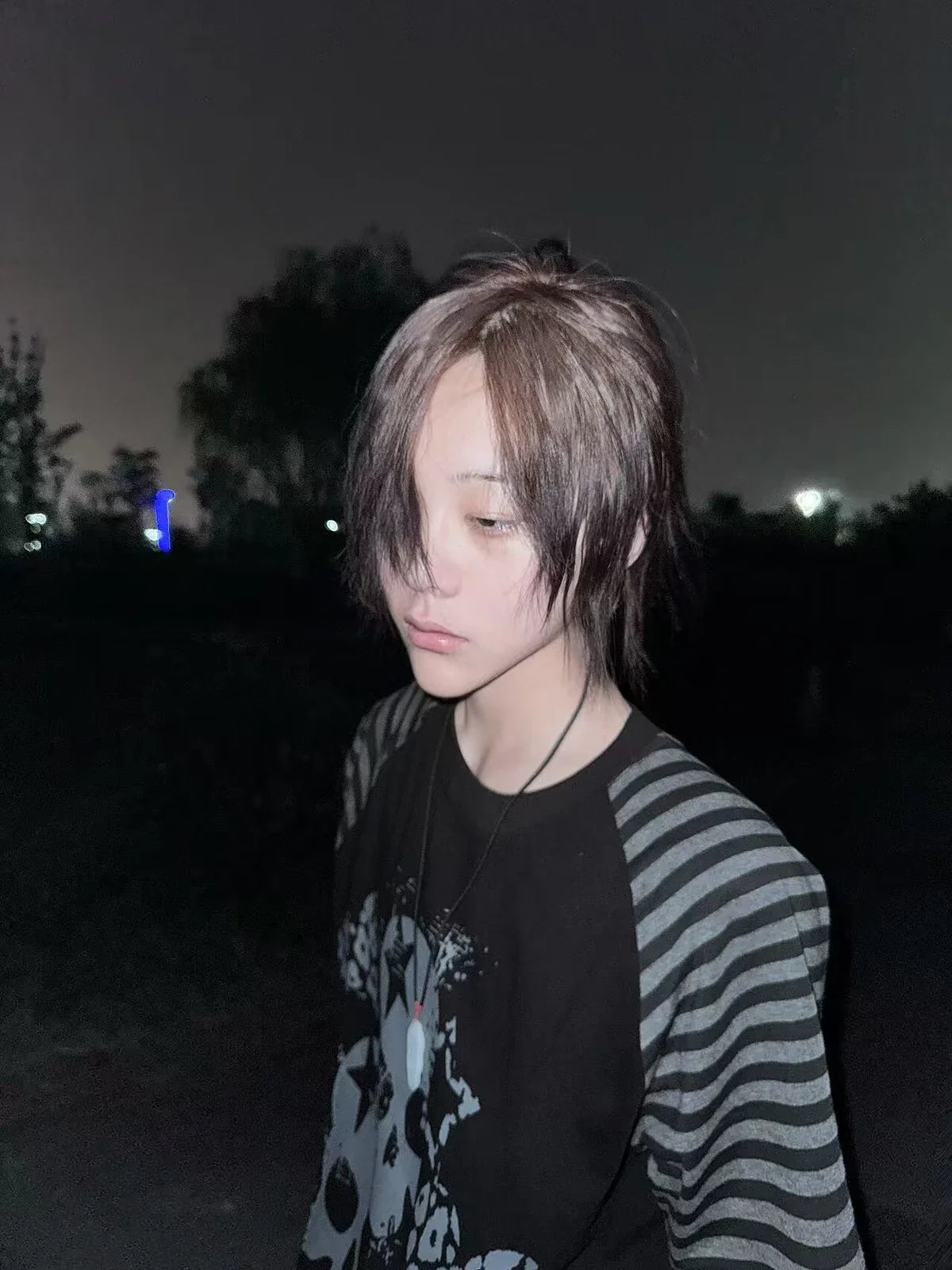 Black Skull Leopard Raglan Graphic Tee in a nighttime side-profile look