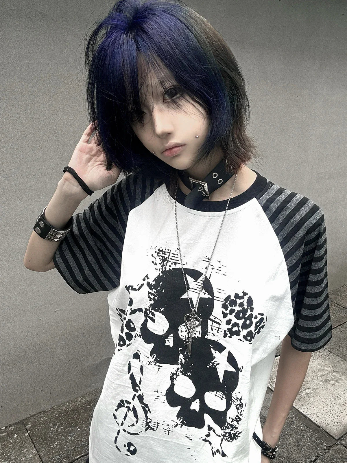 Close-up of the white Skull Leopard Raglan Graphic Tee with blue-hair styling