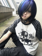 White Skull Leopard Raglan Graphic Tee in a seated blue-hair streetwear look