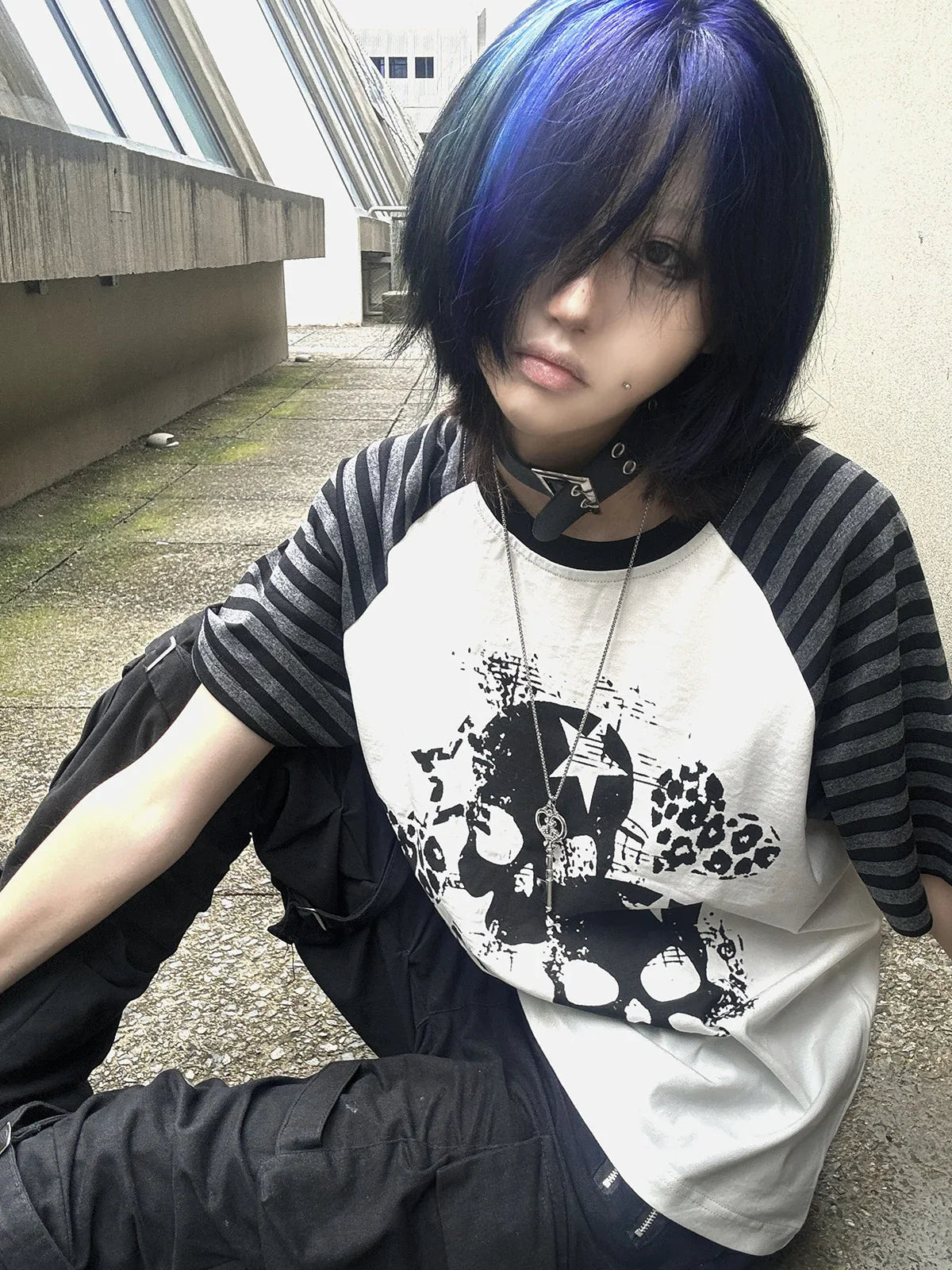 White Skull Leopard Raglan Graphic Tee in a seated blue-hair streetwear look