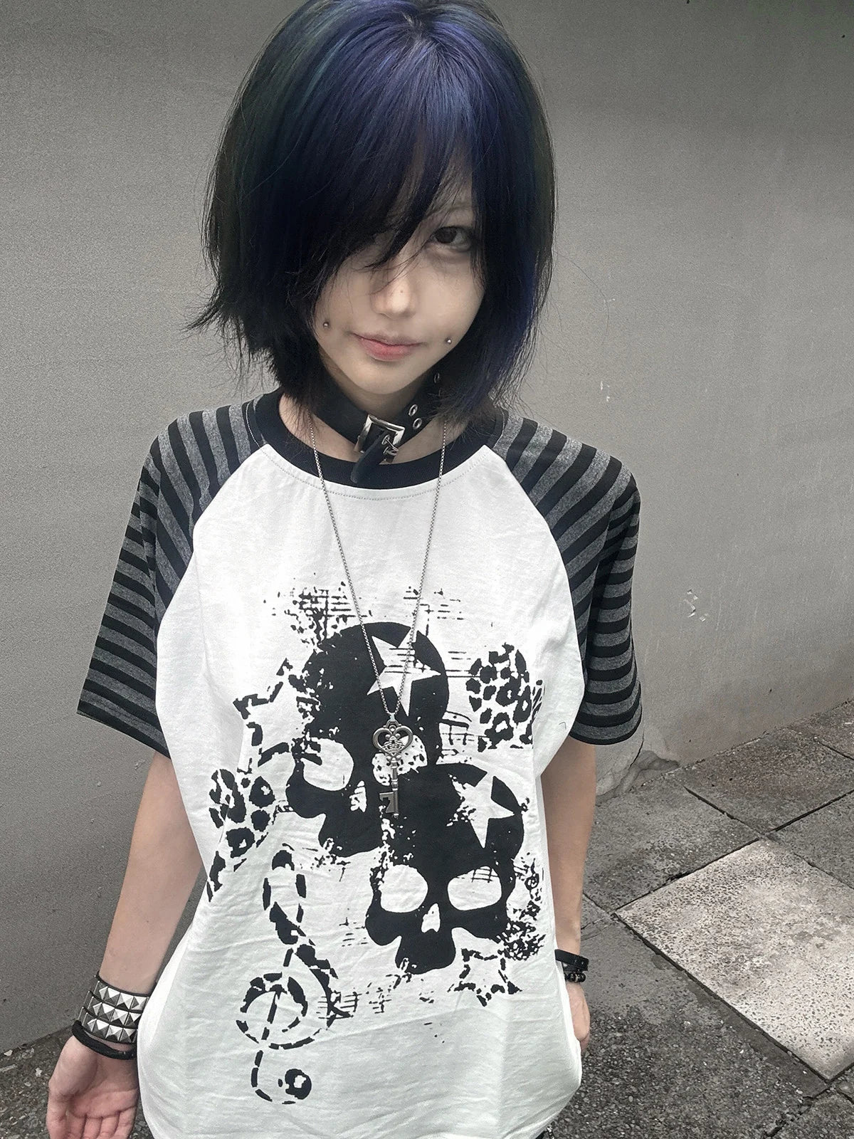 White Skull Leopard Raglan Graphic Tee in a standing blue-hair streetwear look