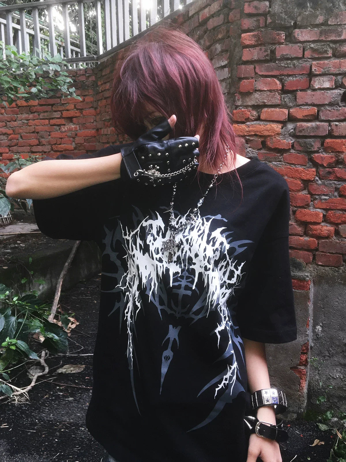 Black Thorned Spider Loose Graphic Tee styled outdoors
